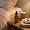 Atorisé bottle on nightstand - part of an evening self-care routine